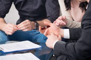 people signing a document