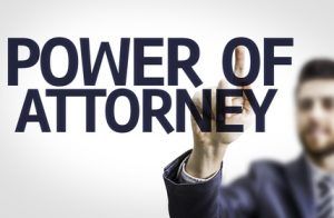 Business man pointing the text: Power Of Attorney