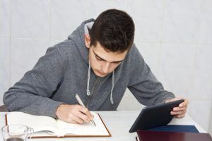 young man studying at home, lifestyle