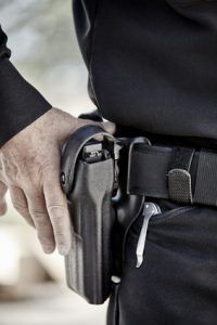 police officer law enforcement man with gun closeup