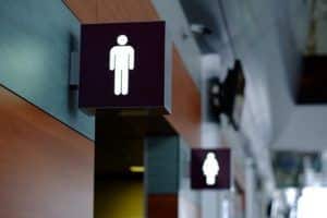 entrance to the male and female toilet. Sign in airport