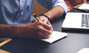 Man writing on paper